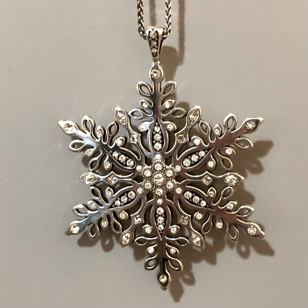 Brighton Snowflake necklace is silver, with Swarovski crystals. Adj 32” to 34”.